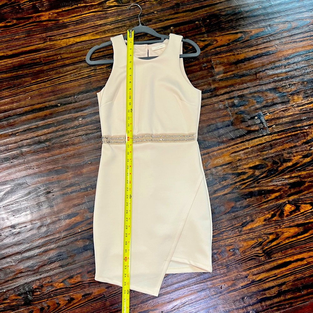 Ivory tulip hem dress with rhinestone and pearl waistband.